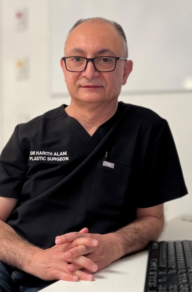 Dr Harith Alani Plastic Surgeon BIO Photo in Scrubs